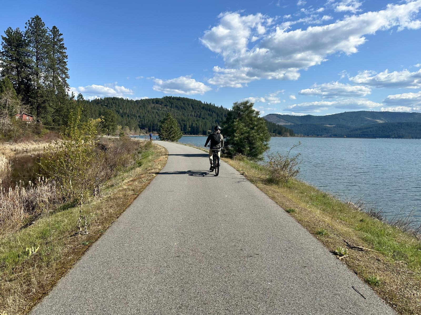 Riding the Trail of the Coeur d'Alenes along the lake